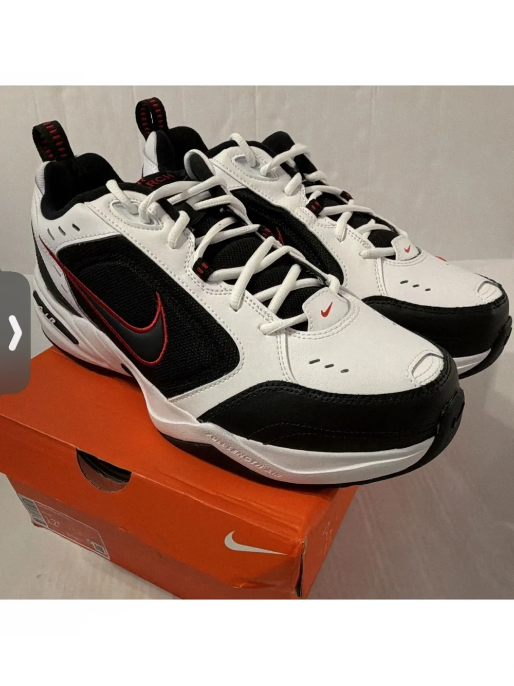 Nike Air Monarch IVMen’s White & Black Athletic Sneakers with Red Accents